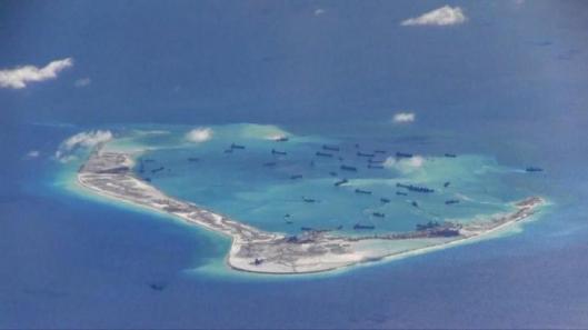 FILE PHOTO -  Still image from United States Navy video purportedly shows Chinese dredging vessels in the waters around Mischief Reef in the disputed Spratly Islands