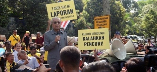 Malaysia's opposition coalition prime ministerial candidate Mahathir Mohamad speaks against a controversial proposal to redraw electoral boundaries outside near the Parliament House in Kuala Lumpur